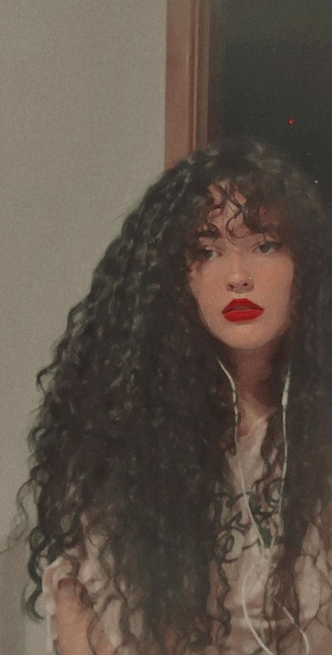 Curly Bangs Wispy, Curly Straight Across Bangs, Butterfly Bangs Curly Hair, Long Hair With Bangs Curly, Curly Bangs Aesthetic, Gothic Curly Hair, Long Curly Hair With Fringe, Curly Long Hair With Bangs, Curly Bangs Long Hair