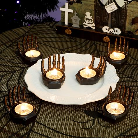 PRICES MAY VARY. MATERIAL: These set of 6 ghost hand tealight candle holders are made of resin with white painted in surface, heavy enough, is best candle centerpieces for tables. PERFECT SIZE: These skeleton hand tea light candle holders measures 2.2" W x 2.2" H, ideal for any counter top or table. These Halloween candle holders are perfect Halloween table decorations for home, indoor, office, living room, kitchen, balcony, party. Enjoy the holiday season with these Halloween ghost hands. CANDL Ghost Hands, Halloween Candle Holders, Balcony Party, Table Decorations For Home, Halloween Candle Holder, Best Candle, Centerpieces For Tables, Tea Light Candle Holders, Halloween Candle