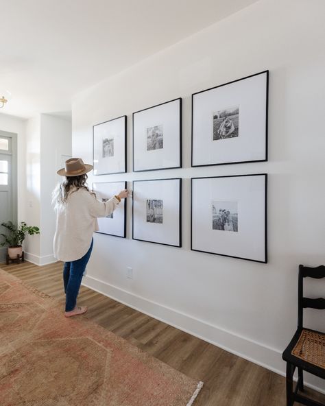 Large Black Frames On Wall, Gallery Wall Foyer, Black Frames On Wall, Entry Way Gallery Wall, Hallway Photo Gallery, Picture Frame Layout, Family Photos Wall Decor, Home Gallery Wall, Family Pictures On Wall