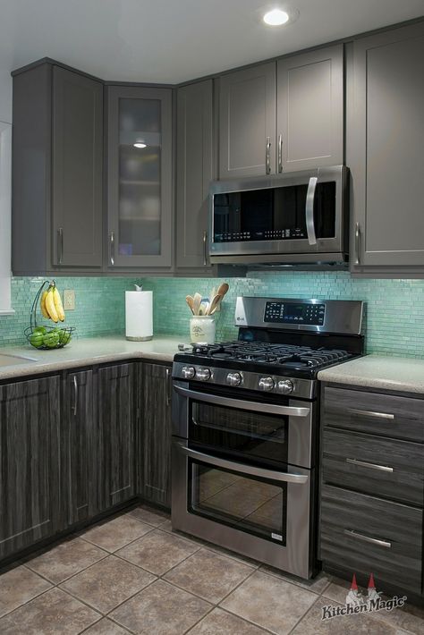 This turquoise-hued glass tile backsplash pairs beautifully with the adjacent gray cabinets! 😍 | Do you love glass backsplashes as much as we do? Learn why designers love them too, in this blog article! #glassbacksplash #glasstile Light Teal Kitchen Walls, Backsplash For Gray Cabinets, Distressed Kitchen Cabinets Diy, Kitchen Cabinet Refacing, Modern Kitchen Backsplash, Kitchen Design Gallery, Beautiful Kitchen Cabinets, Turquoise Kitchen, Teal Kitchen