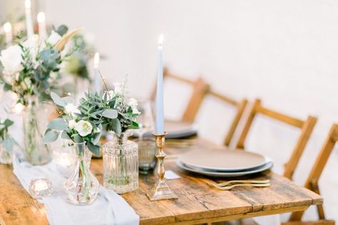 Reclaimed wood trestle table with an elegant baby blue silk table runner, bud vases and tapered candles. Taper Candles And Bud Vases, Candles And Bud Vases, Bud Vase Centerpiece, Blue Taper Candles, Becoming An Event Planner, Baby Blue Weddings, Elegant Winter Wedding, Blue Table Runner, Tapered Candles