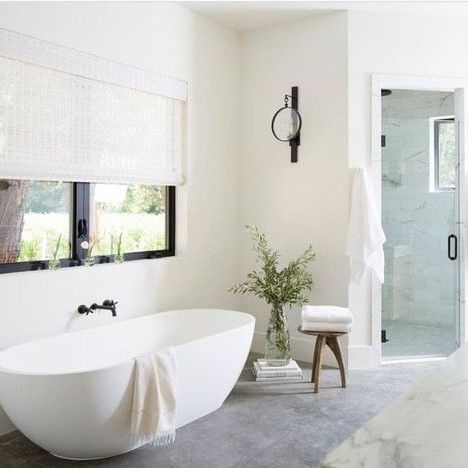 I'm in LOVE with this bathroom! It's full of natural light, I love the subtle balance of cool & warm colors between the floor & walls. I love the details, the way they brought the outdoors in with the greenery & the stool holding the towels to keep them in reach of the tub. I would love coming home to this bathroom!  #inspiration #design #interiordeisgn #bathroomdesign #bathroomdecor #bathroominspo #luxurylifestyle #badeloftusa #relaxation #houzz #renovation #remodel #upgrade #lighting #flooring Modern Farmhouse Bathrooms, Mid Century Ranch, Modern Farmhouse Bathroom, Master Bath Remodel, Walla Walla, Bathroom Spa, Bathroom Renos, Building Ideas, Bathroom Remodel Master