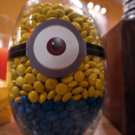 Minion themed M&M candy jar for birthday parties and events. Activities For Birthday Party, Nick Jr Characters, Activities For Birthday, Dusty Crophopper, Despicable Me Party, Disney Movie Characters, M M Candy, Party Favor Ideas, Minion Birthday