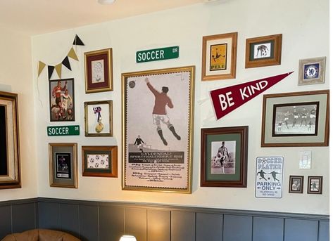 Sports Wall Collage Ideas, Decorating With Sports Memorabilia, Framed Jerseys On Wall Basement, Soccer Gallery Wall, Sports Picture Wall Ideas, Sports Office Decor Ideas Men, Gym Gallery Wall, Gallery Wall With Pennant Flag, Vintage Sports Man Cave