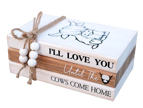 PRICES MAY VARY. 【HANDCRAFTED WOOD BOOK STACK】This farmhouse stacked books decor consists of 3 books made of solid cedarwood. White and brown painted with slight distressing finish. Cute "cattle" printed on top book face, while books' spine has warm inspirational quote "I'll Love You Until the Cows Come Home". 3 farmhouse wood books glued together, won't move to get loose, bookstack bound with rustic twine,the hemp rope's ends are threaded with wood beads. 【HIGHTLAND COW DECOR】This farmhouse ins Farmhouse Tabletop Decor, Diy Home Decor Cricut Craft Ideas, Valentine Book Stack, Love You Till The Cows Come Home, Farmhouse Cricut Projects, Farmhouse Signs For Living Room, Stacked Books Decor Diy, Book Stacks Decor, Cricut Home Decor Projects