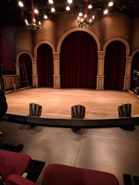 A small stage with three red curtains drapes between doorways and a wooden stage London Theater Aesthetic, Victorian Theater Aesthetic, Old Theater Aesthetic, Vintage Theatre Aesthetic, Old Theatre Aesthetic, Vintage Theater Aesthetic, Theatre Aesthetic, 39 Steps, Jeeves And Wooster