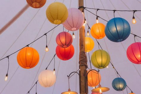 Coloured paper lanterns and festoon lights Birthday Lanterns, Paper Lantern Wedding, Pride Wedding, Paper Lantern Festival, Colourful Lanterns Wedding, Colourful Wedding Marquee Decoration, Colorful Paper Lanterns, Marquee Festoon Lighting, Colourful Bunting Wedding