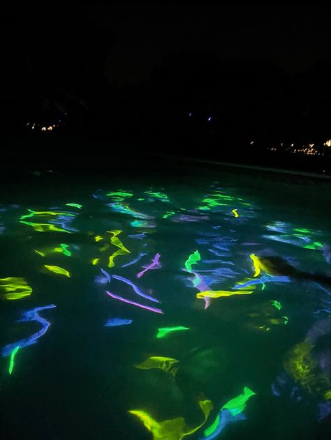 Pool Glow Sticks, Pool Party Glow Sticks, Glow Sticks In The Pool, Glow Stick In Pool, Glow Sticks Pool Party, Glowstick Party Aesthetic, Glow In The Dark Swim Party, Spooky Pool Party, Night Swim Party