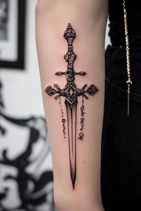 Sword tattoo with intricate details on a person's arm. Viking Dagger Tattoo, Dagger Tattoo Forearm, Dagger Tattoo Ideas, Dagger Tattoos, Traditional Dagger, Vintage Tattoo Art, Camera Tattoos, Jewel Tattoo, Tattoos Arm