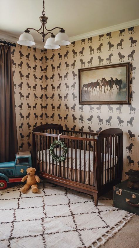 A horse-themed baby girl nursery with equestrian-patterned wallpaper, a dark wood crib adorned with a greenery wreath, a vintage blue toy truck, and a plush teddy bear. The space includes a cream rug with brown accents and warm, rustic farmhouse-inspired decor. Dark Wood Crib, Baby Girl Nursery Ideas, Girl Nursery Ideas, Nursery Inspiration Girl, Wood Crib, Baby Room Inspiration, Horse Wallpaper, Girls Nursery, Baby Girl Nursery