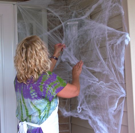 Cotton Spider Web Decoration, How To Put Up Spider Webbing, Spider Webbing For Halloween, Cobweb Decorations Halloween, Spider Web Front Porch, How To Hang Spider Webs For Halloween, Spider Web Front Door, Front Porch Spider Web Decor, Spider Web Door Decoration