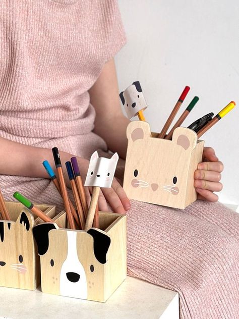 Pet Themed Pencil Holders by Tender Leaf Toys A set of wooden pencil pots to use as organisers for your child creative or work space. Illustrated with a friendly Cat, Dog and Mouse faces. Great along side our Desk and Chair, and a lovely characteristic addition to the nursery. Presented in an illustrated colour box Suitable for ages 3+ Product dimensions: 26.6 x 8 x 10 cms Click on the link below for a free crafty activity! Wooden Pencil Holder, Wood Pencil Holder, Making Wooden Toys, Pencil Holders, Kids Deco, Wood Projects For Beginners, Desk And Chair, Wooden Pencil, Wooden Dog