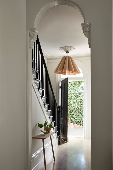 DESIGN | NgLp Designs shares an Old Victorian home renovation with before and after design — "A clean black and white palette greets you as you as the enter the front door. We had to restore the staircase, recreating a period appropriate newel post and bannister as well as recreating a historically accurate plaster ceiling medallion. The oversized pendant offers the air of grandeur this house demands." / architecture, interior design, interior decor, home tour / #home #renovation #blackandwhite Custom Dining Tables, San Francisco Houses, Real Kitchen, California Living, Statement Lighting, Entry Way, Ceiling Medallions, Ceiling Decor, Entrance Hallway