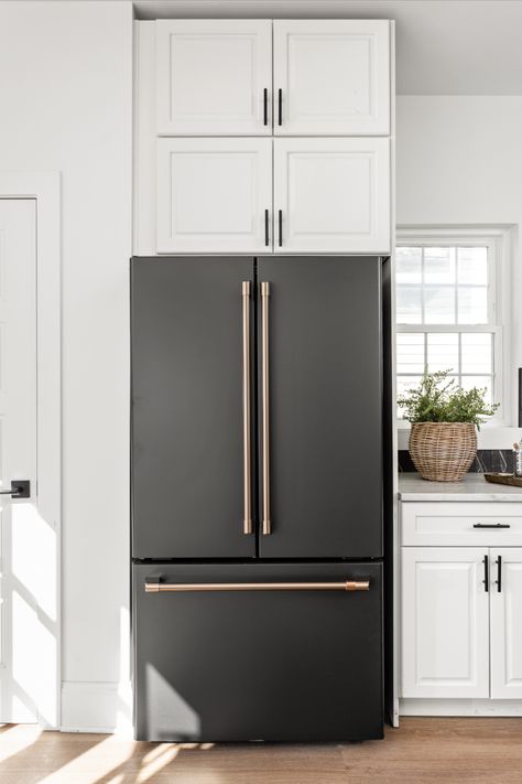 Bring a sense of edgy elegance to your home décor when pairing Matte Black with our Brushed Bronze finish. #CafeAppliances #MatteBlack #BrushedBronze #HomeDecor 

Photo Credit: @thehomeaesthetic 
@twochicksandahammer 

https://www.cafeappliances.com/collections/customizable-professional/matte-black/ Ge Cafe Black Matte, Cafe Matte Black Appliances Kitchen, Black Appliances Gold Hardware, Matte Black Cafe Appliances In Kitchen, Kitchen With Matte Black Appliances, Cafe Appliances Black, Cafe Appliances Matte Black, Black And Gold Appliances, Matte Black Appliances Kitchen