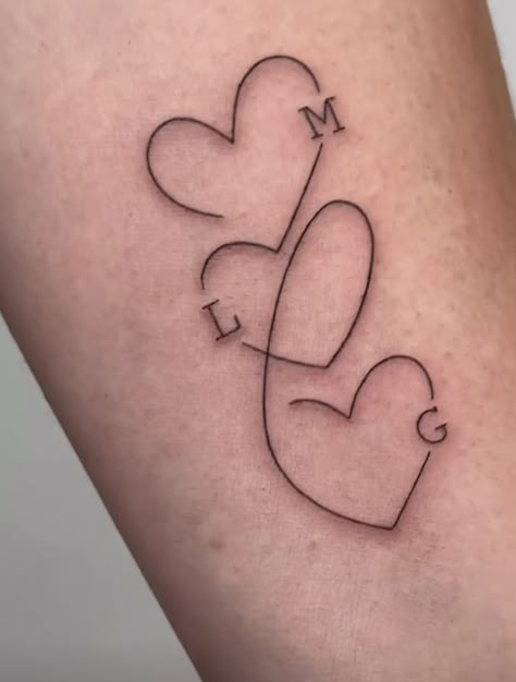 Womens Tattoo For Son, 3 Heart Tattoo With Initials, Minimalist Tattoo Daughter, Heart With Initial Tattoo Letters, Heart Birthdate Tattoo, Heart With D Tattoo, Tattoo For My Siblings, Tattoos Of Children Ideas, Connecting Heart Tattoos