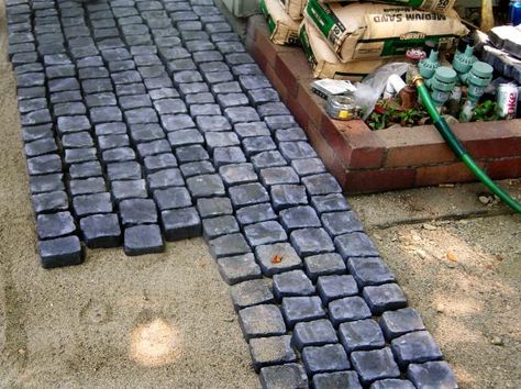 An old concrete patio with a mismatched paver extension gets a completely different look with a stylish cobblestone overlay. Learn how to make it yourself on DIYNetwork.com. Cobblestone Patio, Cobblestone Pavers, Cobblestone Driveway, Cobble Stone, Patio Layout, Concrete Patios, Patio Pavers Design, Paver Walkway, Outdoor Patio Designs