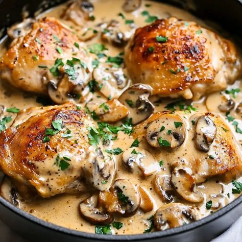 Chicken Thighs With Creamy Mushroom Garlic Sauce Recipe - sandyrecipes.com Creamy Mushroom Chicken Thighs, Chicken Thighs Pasta Recipes, Fish And Mushroom Recipe, Creamy Garlic Herb Cajun Chicken Thighs, Chicken Thigh And Pasta Recipes, Chicken Thigh Recipes Dutch Oven, Mushroom Chicken Recipes, Creamy Garlic Mushroom Chicken, Mushroom Chicken Thighs