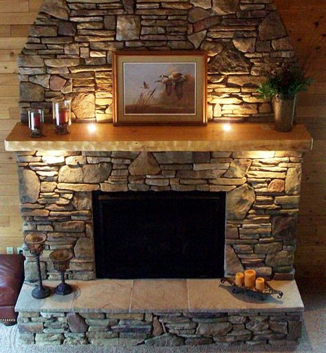 Consider using small LED uplights on the fireplace to give the area a brightness even when there's no fire beneath the mantle. Contemporary Fireplace Mantels, Fireplace Mantels Ideas, Fireplace Decorating, Fireplace Mantel Designs, Stacked Stone Fireplaces, Rustic Fireplace Mantels, Stone Fireplace Mantel, Natural Stone Fireplaces, Mantel Design