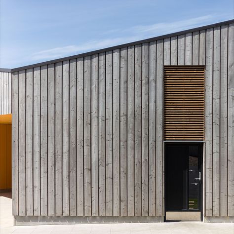 Scottish Larch Cladding used on commercial building on the Isle of Harris Vertical Timber Cladding Exterior, Hit And Miss Timber Cladding, Hit And Miss Cladding, Weathered Timber Cladding, Charred Wood Cladding, Charred Larch Cladding, Exterior Timber Cladding, Board On Board Cladding, Vertical Cedar Cladding