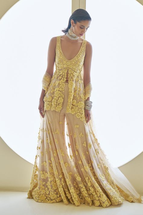 Shop for these amazing collections of Yellow Net Embroidery Sequins Deep V Flower Peplum Tunic Sharara Set For Women by Seema Gujral online at Aza Fashions. Heavy Sharara Suit, Sangeet Board, Floral Sharara, Mirror Lehenga, Seema Gujral, Mehendi Outfit, Haldi Outfits, Haldi Outfit, Desi Outfits