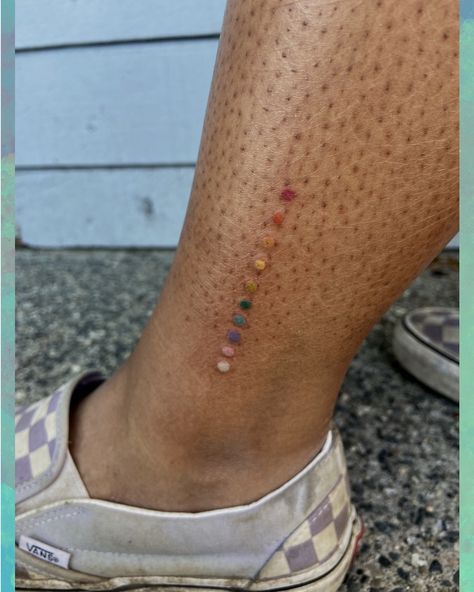 Rainbow Dots Tattoo, Colour Line Tattoo, Tattoo Color Test, Coloured Tattoo On Dark Skin, Blue Dot Tattoo, Color Test Tattoo, Color Tattoos On Dark Skin, Tattoo Dark Skin, Straight Line Tattoo