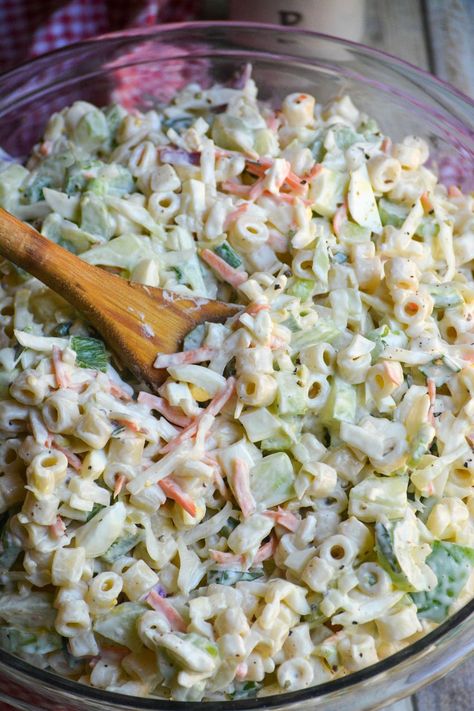 a wooden spoon in a bowl of creamy coleslaw pasta salad Coleslaw Pasta Salad, Coleslaw Pasta, Football Dips, Big Salads, Cabin Food, Classic Picnic, Creamy Salad, Picnic Side Dishes, Creamy Pasta Salads