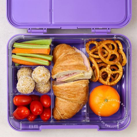 Unveiling our Bento Box of the week! 🏆🍱 Today's star is a scrumptious ham and cheese croissant 🥐 that's sure to make lunchtime the best time of the day. But that's not all! Fresh cherry tomatoes 🍅, crunchy carrot and celery sticks 🥕, some apricot bliss balls for a touch of sweetness 🍑, and of course, everyone's favourite - pretzels for a tasty crunch! 🥨 And what's a bento box without some fruity fun? We've added a mandarin 🍊 to give your kids that zesty burst of flavour and vitamin C. Thanksgiving Bento Box Ideas, Bento Box Snacks For Kids, Omie Box Lunch Ideas Kids, Lunch Box Snacks For Kids, Japanese Bento Box Lunch For Kids, Breakfast Bento Box Ideas, Bento Box Breakfast, Kid Lunch Box Ideas, Pack Lunch Ideas