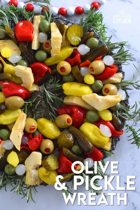 This bright and shiny edible wreath is packed full of sweet, salty, and tangy flavour! Consisting of your favourite pickled and marinated foods, an Olive and Pickle Wreath is the answer to every host's holiday appetizer table. Assemble on a platter and refrigerate until ready to serve. It's easy, delicious, and festive! #olives #pickles #charcuterie #christmas #holiday #partyfood Cheese And Pickle Charcuterie Board, Pickle Olive Tray, Christmas Relish Tray Ideas, Pickle And Olive Tray Ideas, Christmas Relish Tray, Pickle Tray Ideas, Sweet Dill Pickles, Pickle Board, Pickle Tray