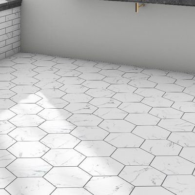 Meant to capture the appearance of marble, these tiles offers this timeless look in a durable, easy to maintain option. This hexagon shaped tile is perfect for any setting traditional enough for historical renovations or modern enough for new construction. It is available in forty-seven print variations that are randomly scattered throughout each case. This tile is durable and safe for heavy-duty interior and exterior locations including industrial applications. Tile is the better choice for you Patterned Wall, Historic Renovation, Floor Tile Design, Merola Tile, Porcelain Mosaic Tile, Marble Mosaic Tiles, Hexagon Tiles, Bathroom Floor Tiles, Natural Stone Tile