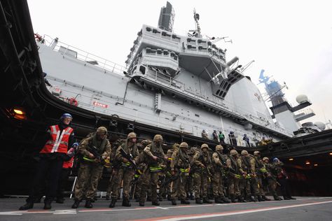 HMS ILLUSTRIOUS is currently taking part in an exercise off the South coast of the UK. Elements of 45 Commando were projected ashore as part of the exercise. The Royal Marines are embarked onboard HMS ILLUSTRIOUS for this exercise and the following deployment to the Mediterranean. They got their kit together in the mighty warships aircraft hangar, then went up on the aircraft lift to the flight deck where they boarded waiting Seakings from the Commando Helicopter Force. Hms Interceptor, Hms Illustrious, Royal Marine Commando, Baltic Hms 002, Hms Formidable, Aircraft Hangar, Hms Victorious Aircraft Carrier, Super Hyper-dreadnought Battleship Tosa, Royal Marines