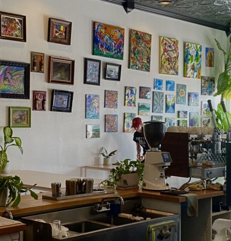 Gallery wall with lots of framed photos and paintings in a little coffee shop with plants Art Gallery Aesthetic, Aesthetic Coffee Shop, Gallery Aesthetic, In Aesthetic, Artist Aesthetic, Aesthetic Coffee, Business Idea, Flower Shop, Camera Roll