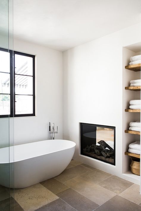 Modern country bathroom with fireplace| Photos by Laure Joliet via Remodelista Modern Country Bathrooms, Modern Country Bathroom, Country Bathroom Designs, Bathroom Fireplace, Double Sided Fireplace, Bad Inspiration, Spanish Style Home, Country Bathroom, Spanish Style Homes