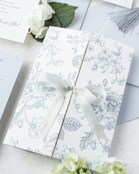 This custom-printed floral gatefold is more than just stunning—it’s the perfect way to hold all your invitation pieces together in one elegant package. Tied with a delicate dusty blue ribbon, it adds a layer of sophistication that your guests won’t forget. 💌⁠ ⁠ Looking for unique ways to elevate your wedding stationery? Visit my website to explore more designs and ideas to make your invitations truly tailored to your style. Link in bio!⁠ ⁠ #WeddingInvitationSuite #FloralWeddingDetails #Gatef... Invitation Sleeve, Instagram Features, Wedding Invitation Suite, Fairytale Wedding, Blue Ribbon, Dusty Blue, My Website, Wedding Details, Wedding Stationery