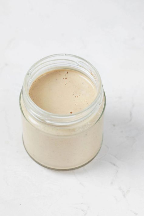 This balsamic Dijon tahini dressing is equal parts sweet and tangy—in a wonderful way! If you love a traditional balsamic vinaigrette, then you'll love this creamy alternative, which has the added bonus of nutrient density from sesame seeds. Tahini Vinaigrette, Tahini Dressing, Balsamic Vinaigrette, Sesame Seeds, Dijon, Tahini, If You Love, Love A, Spreads