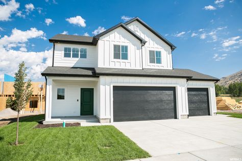 721 N 200 E White House Black Garage Door, Black And White Exterior, Walks In The Rain, Black Garage Door, Black Garage, White Exterior Houses, White Siding, Garage Exterior, Shingle Exterior