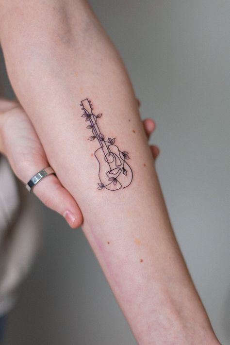 Mini Forearm Tattoo, Guitar Tattoo Forearm, Fineline Guitar Tattoo, Pretty Music Tattoos, Music Tattoo For Women, Guitar And Music Tattoo, Cute Guitar Tattoos, Line Art Guitar Tattoo, Ukulele Tattoo Ideas