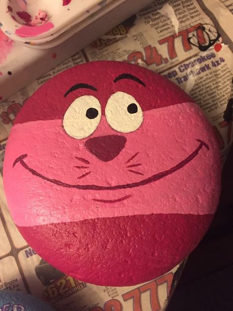 Cheshire Cat rocks painted Disney rock Rock Kunst, Painted Rock Ideas, Rock Painting Tutorial, Painted Rock Animals, Rock Painting Ideas, Painted Rocks Kids, Painted Rocks Diy, Rock Painting Ideas Easy, Rock Painting Patterns