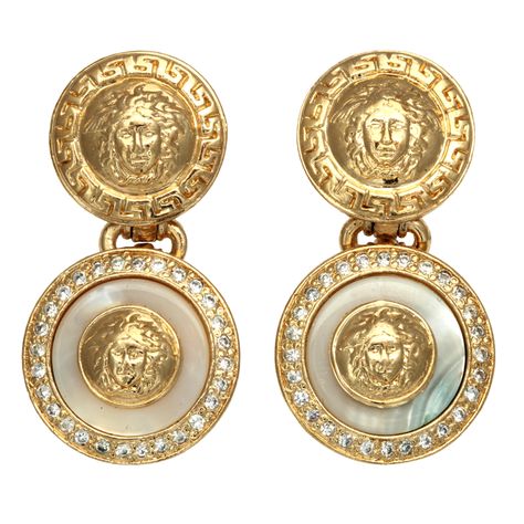 Gianni Versace white and gold dangling earrings with Medusa motifs | From a unique collection of vintage clip-on earrings at https://www.1stdibs.com/jewelry/earrings/clip-on-earrings/ Versace Jewellery, Gold Dangling Earrings, Versace Earrings, Earrings White Gold, Versace Gold, Versace Jewelry, Long Gold Earrings, Gold Dangle Earrings, Gold Chains For Men