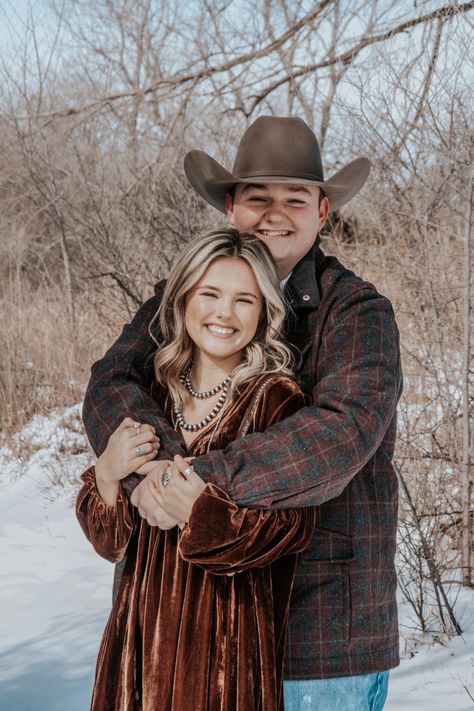 Dress is from Shein, jewelry is from CalliCo silver. his hat is American, shirt is cinch, and coat is powder river. Couple Winter Photoshoot, Photo Shoot In The Snow, Couple Horse Photography, Western Photo Shoot, Western Senior Picture Ideas, Country Couple Photos, Western Engagement Pictures, Western Photoshoot Ideas, Western Couple Photoshoot