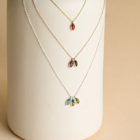 The best way to commemorate everyone in your family is here. Our Custom Marquise Birthstone Necklace allows you to customize the number of gemstones you would like to include everyone you would like to honor. This dainty necklace makes for a great gift for the important mother figures in your life. Material: High Quality Solid 925 Sterling Silver Finish: Sterling Silver ∙ 18K Gold ∙ Rose Gold Personalized: Default design comes with up to 3, ~5 x 2mm Marquise Gemstones SKU: MM-NM127 Necklace With Stone Pendant, Momma Necklace, Birthstones Necklace, Modern Necklace Design, Birthstone Necklaces, Initial Tag Necklace, Mom Necklace Personalized, Sideways Initial Necklace, Dainty Initial Necklace