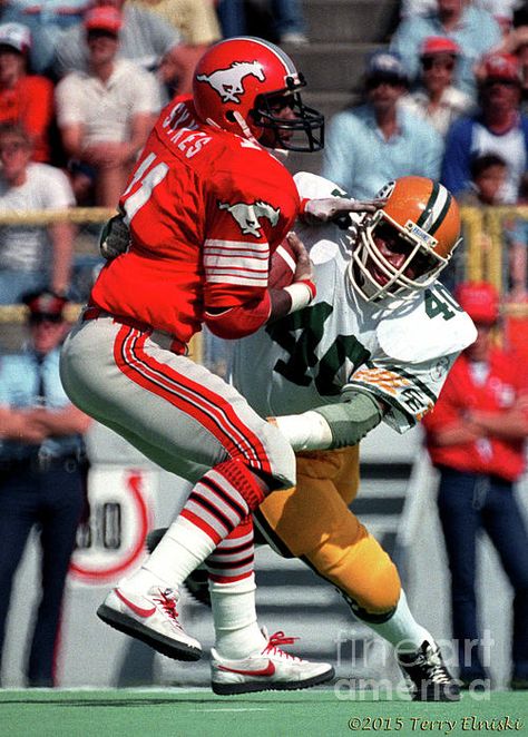 Action photograph taken of James "Quick" Parker #40 of the Edmonton Eskimos making a tackle on Calgary Stampeder running back James Sykes. Taken on Labour Day in Calgary, 1982. James Parker, Fantasy Football Names, Fantasy Football Funny, Canadian Football League, Canadian Football, Blonde Hairstyle, Teen Style, Nfl Football Players, Hairstyle Idea