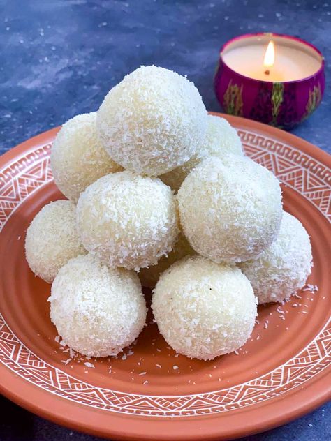 instant coconut laddos made with condensed milk placed over one another on a plate with light candle on the side Easy Indian Sweet Recipes, Coconut Condensed Milk, Coconut Ladoo Recipe, Coconut Ladoo, Ladoo Recipe, Rakhi Special, Orange Cake Recipe, Condensed Milk Recipes, Veggie Delight