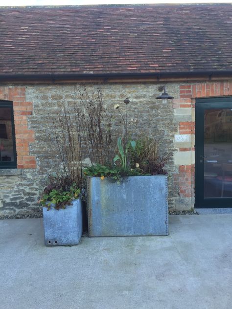 Large galvanised steel planters in court yard at Hauser & Wirth Somerset. Galvanised Planter Ideas, Zinc Planters Container Gardening, Corten Steel Planters Front Yard, Cedar And Galvanized Metal Planter, Corten Raised Beds, Galvanised Planter, Round Corten Steel Planters, Large Garden Planters, Galvanized Planters