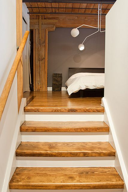 wooden step with contrast matchy with linens and loft hard woods. sleeping area, creative lighting and wooded beam archway with recessed lighting. Beam Archway, Wooden Steps Indoor, Steps Indoor, Candy Factory, Construction Ideas, Wooden Steps, Dr House, Steps Design, Bungalow House