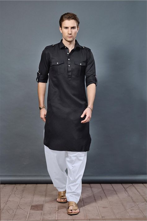 Let's celebrate this Eid with our latest Pathani collection. This black color Pathani suit, it features from cotton fabric, two flap on shoulder add more glam in this outfit, it comes with white color pathani salwar. Black Kurta Pajama Men Pathani, Mens Pathani Kurta Style, Man Kurta Designs Style, Black Pathani For Men, Pathani Kurta For Men, Pathani Suit For Men, Eid Salwar Kameez, Black Pathani, Pathani Kurta Pajama