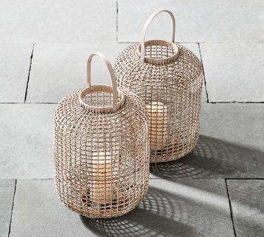 11 Gorgeous Modern Farmhouse Decor Ideas | Hunker Rattan Ideas, Rattan Home Decor, Rattan Lantern, Coastal Apartment, Small Seating Area, Modern Farmhouse Decor Ideas, Modern Lanterns, Meditation Room Decor, Small Balcony Design