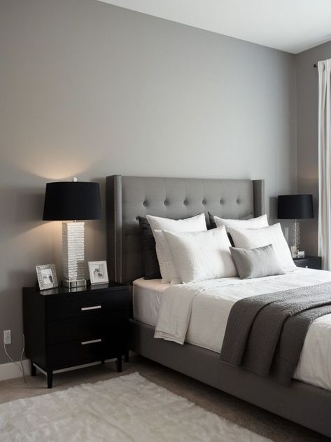 Create a chic and modern look by painting one wall in your bedroom a light gray color. Pair it with a sleek and minimalist black or white bed frame, and accessorize with metallic accents for a touch of elegance. Light Gray Accent Wall, Light Grey Bed Frame, Silver Bedside Table, Gray Accent Wall, Light Grey Bed, Gray Upholstered Bed, Grey Accent Wall, Grey Bed, Grey Bed Frame