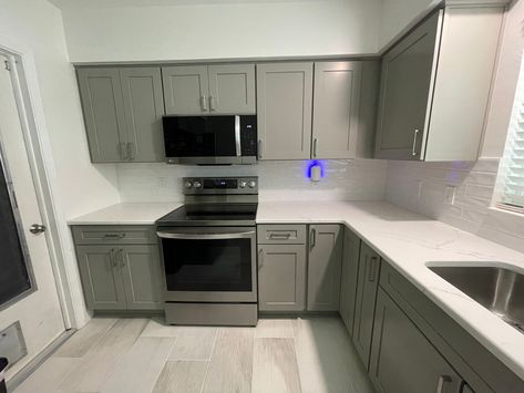 The cabinets were done in the Catalina door in birch and a pebble grey color. Pebble Grey, Grey Kitchen Cabinets, Kitchen Cupboard, Transitional Kitchen, Grey Cabinets, Grey Kitchens, Grey Kitchen, Kitchen Remodeling, Kitchen Remodel Idea