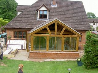 Oak framed conservatory sunroom | Oak framed sunroom built u… | Flickr Oak Conservatory, Cabin Addition, Conservatory Sunroom, Front Extension, Oak Framed Extensions, Timber Frame Porch, Framed Windows, Border Oak, Porch Gazebo