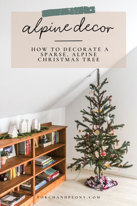 From the history of Christmas trees to the best formula to decorate a sparse alpine Christmas tree, check out this post for all the ways for decorating your sparse tree this Christmas! | Alpine Christmas Decor | Alpine Christmas Tree | Alpine Christmas Tree Ideas | Sparse Christmas Tree | Sparse Christmas Tree Decorations | Sparse Christmas Tree Decorating | Sparse Christmas Tree Ideas | Sparse Tree Decorating | Christmas Tree Ideas | Christmas Tree Decorations | Christmas Tree Original Decor Alpine Christmas Tree Ideas Decor, Alpine Fir Christmas Tree, Sparse Christmas Tree Decorated, Alpine Tree Decor Ideas, Sparse Christmas Tree Ideas, How To Decorate A Sparse Christmas Tree, Alpine Christmas Tree Ideas, Decorating Christmas Tree Ideas, Christmas Tree Placement